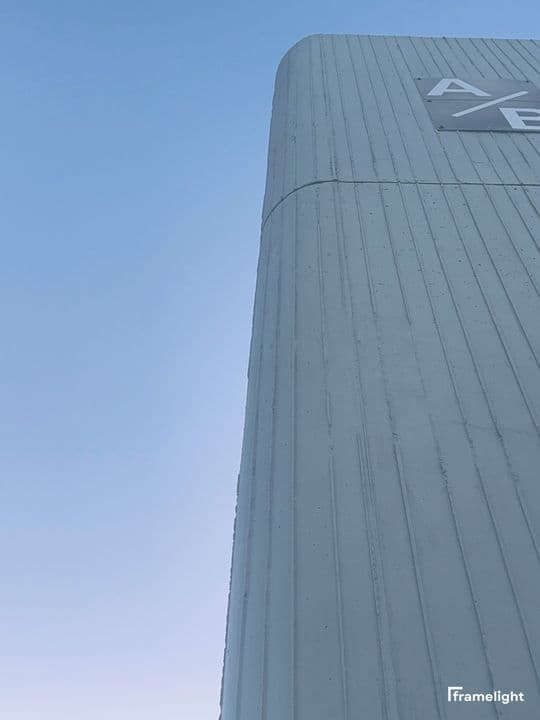Concrete tower against a gradient blue sky